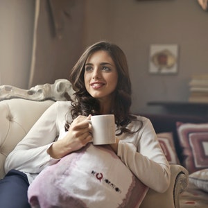girl holding a cup of coffee